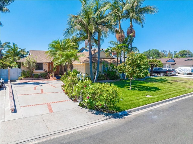 view of front of house with a front lawn and a garage