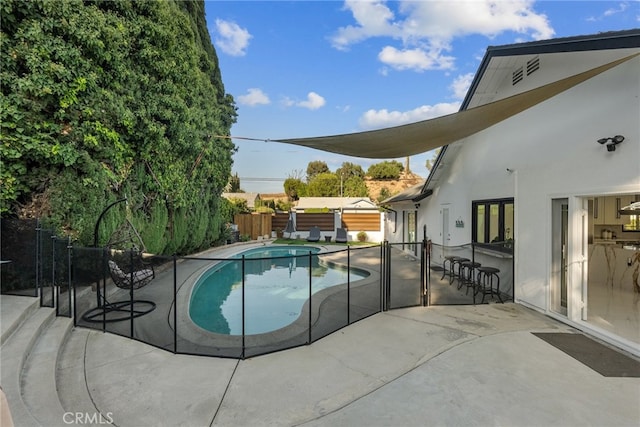 view of swimming pool featuring a patio