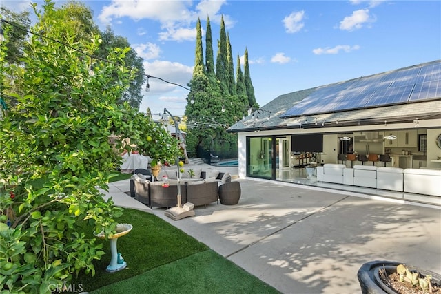 view of patio / terrace with a pool and an outdoor living space