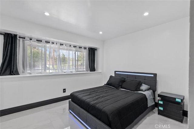 bedroom featuring recessed lighting, baseboards, and marble finish floor