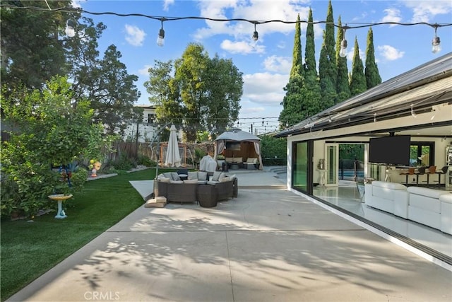 view of patio / terrace featuring fence and an outdoor hangout area
