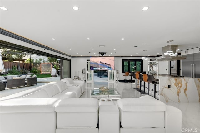 living room featuring a wealth of natural light and crown molding