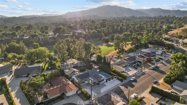 birds eye view of property featuring a mountain view