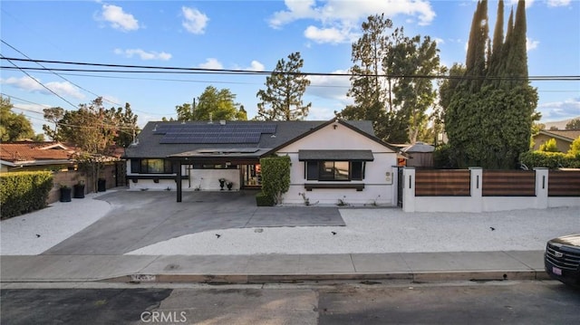 view of front of home featuring solar panels