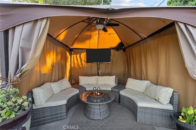 view of patio with a gazebo, outdoor lounge area, and ceiling fan