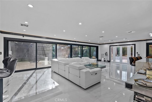 living room featuring crown molding, recessed lighting, marble finish floor, and visible vents