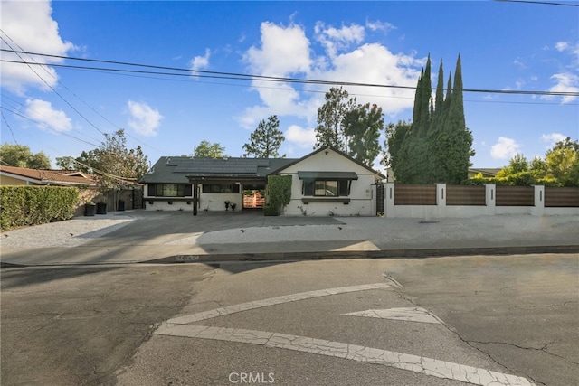 view of front of home featuring a carport