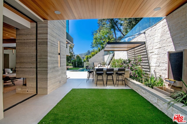 view of yard featuring a swimming pool and a patio