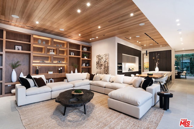 living room featuring wood ceiling and built in shelves