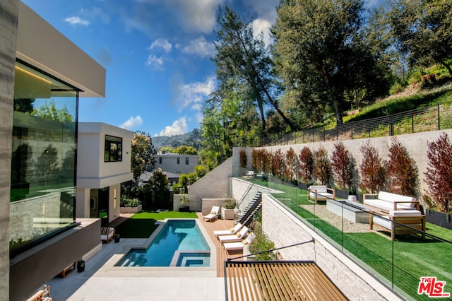 view of pool with a yard and an outdoor hangout area