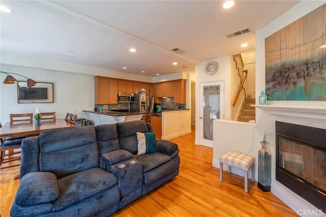 637 S Grand Ave Unit 4, San Pedro, CA 90731 - living room featuring light wood-style flooring, recessed lighting, and stairway