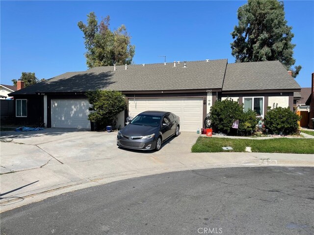 ranch-style house featuring a garage