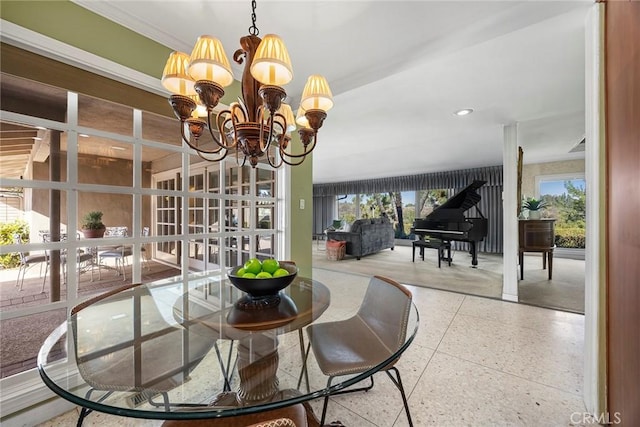 dining room featuring plenty of natural light and an inviting chandelier