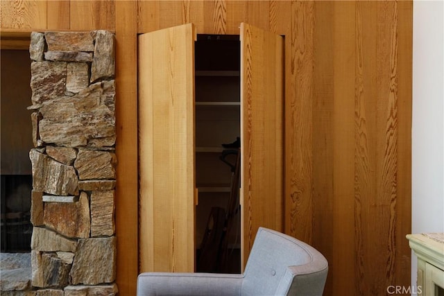 bathroom with wood walls