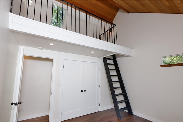 interior space featuring wood-type flooring, wood ceiling, and high vaulted ceiling