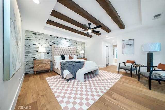 bedroom featuring light wood-type flooring and ceiling fan