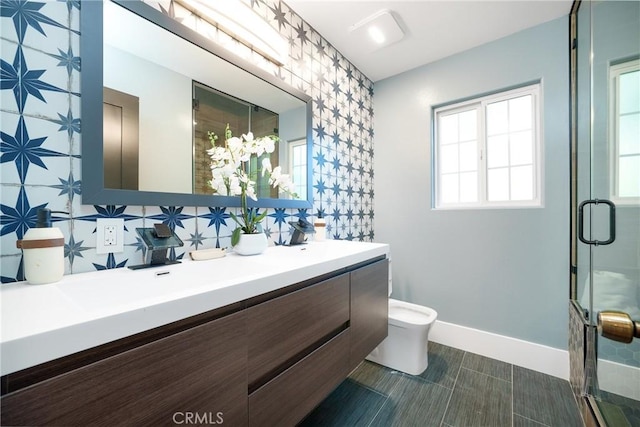 bathroom featuring vanity, tasteful backsplash, toilet, and an enclosed shower