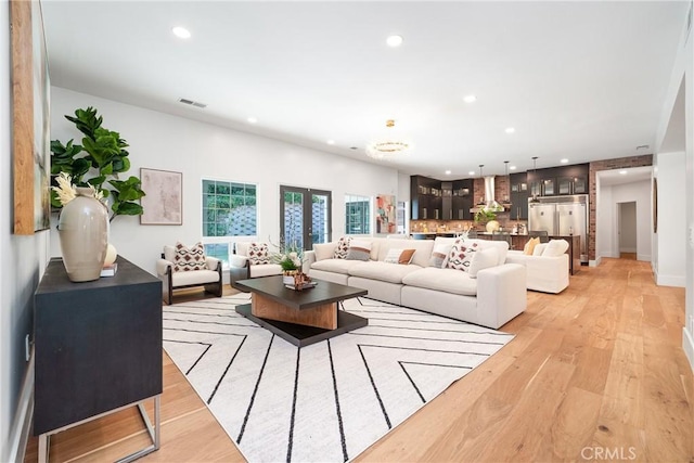 living room with light hardwood / wood-style floors