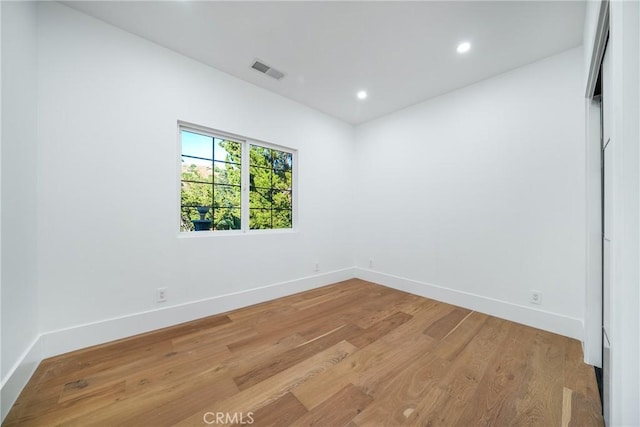 unfurnished room with light hardwood / wood-style flooring