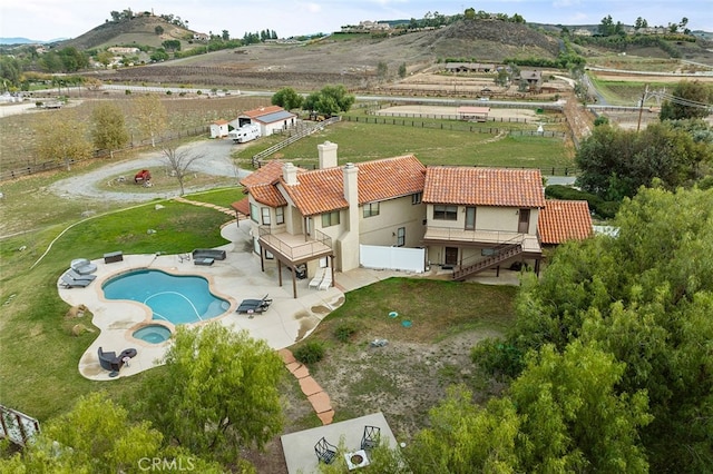 birds eye view of property featuring a mountain view