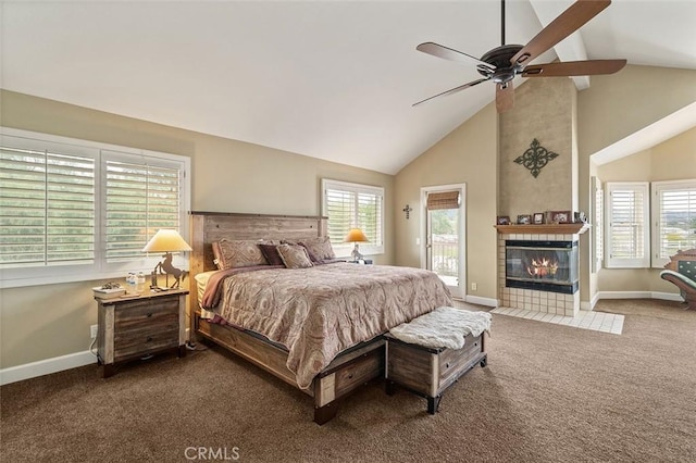 carpeted bedroom featuring ceiling fan, access to exterior, a tiled fireplace, and high vaulted ceiling