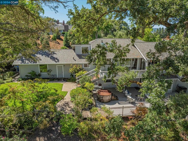 back of house featuring a patio and an outdoor fire pit