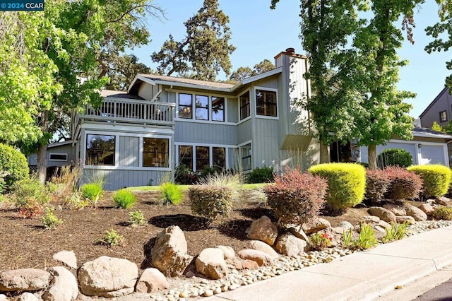 view of front of home featuring a balcony