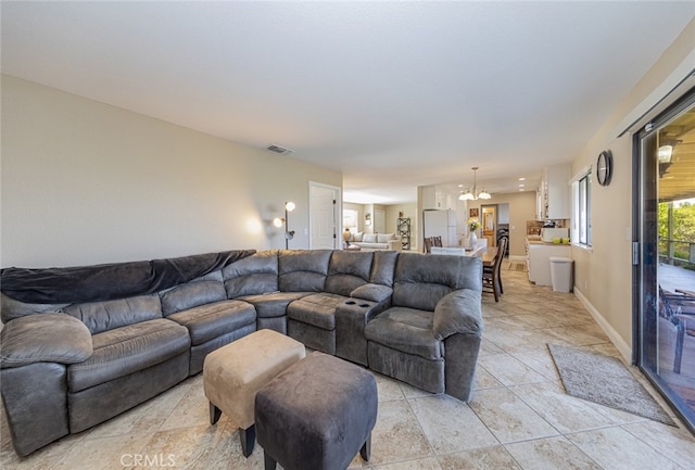 living room featuring a chandelier