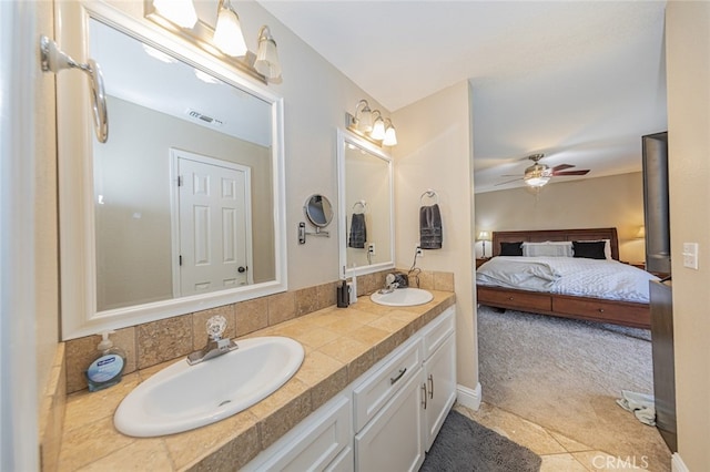 bathroom featuring ceiling fan and vanity