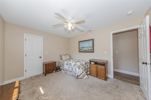 carpeted bedroom featuring ceiling fan