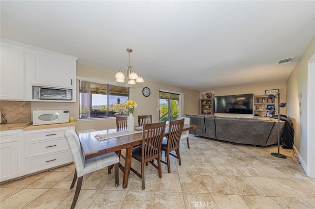 dining room with an inviting chandelier