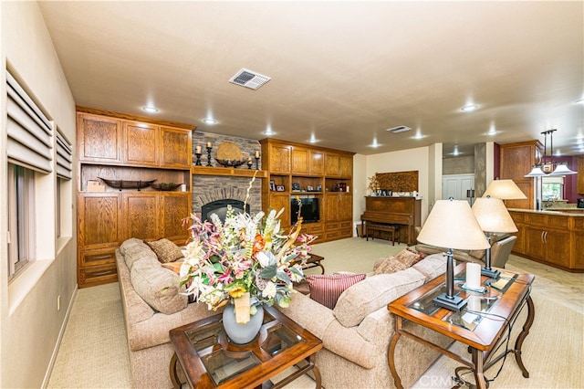 carpeted living room featuring a fireplace