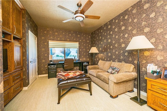 carpeted living room with a textured ceiling and ceiling fan