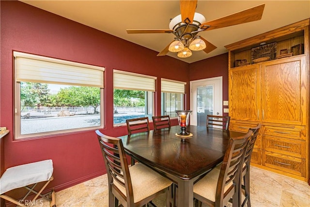 dining space featuring ceiling fan