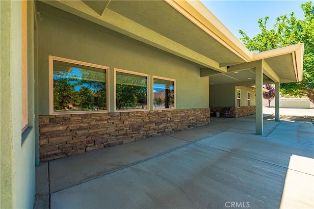 view of property exterior featuring a patio