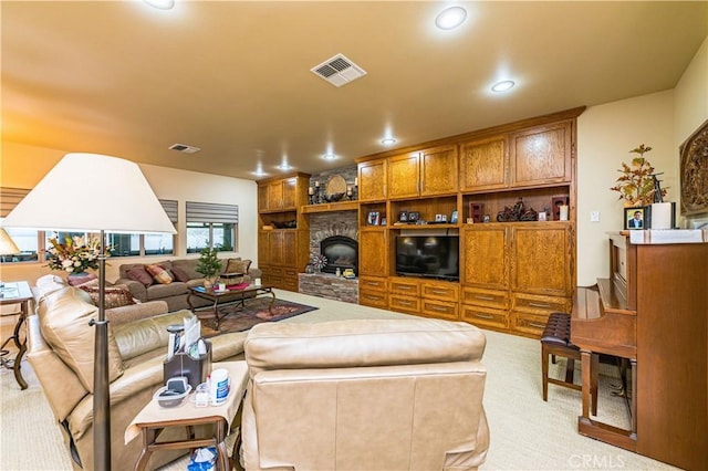 carpeted living room with a fireplace