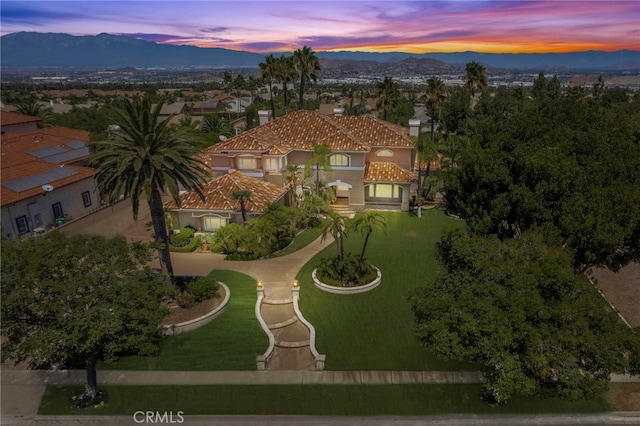 aerial view at dusk with a mountain view