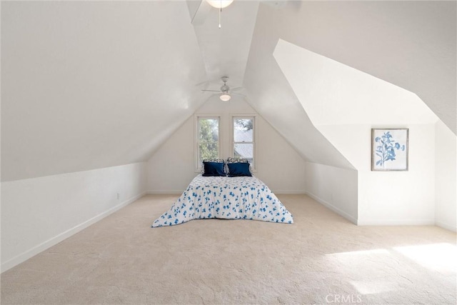 carpeted bedroom with ceiling fan and lofted ceiling