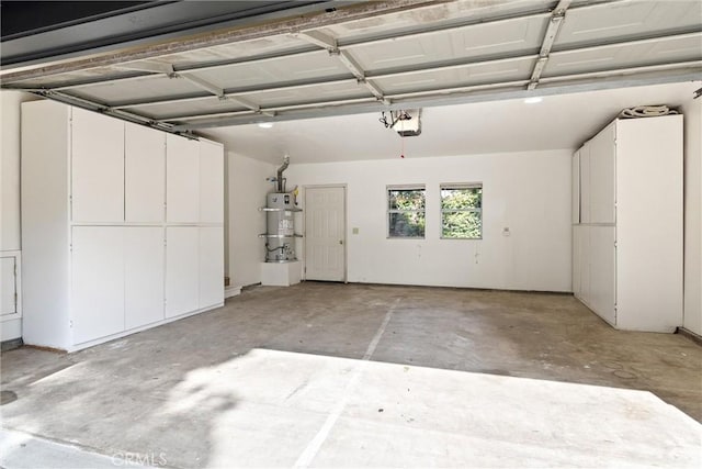 garage with a garage door opener and strapped water heater