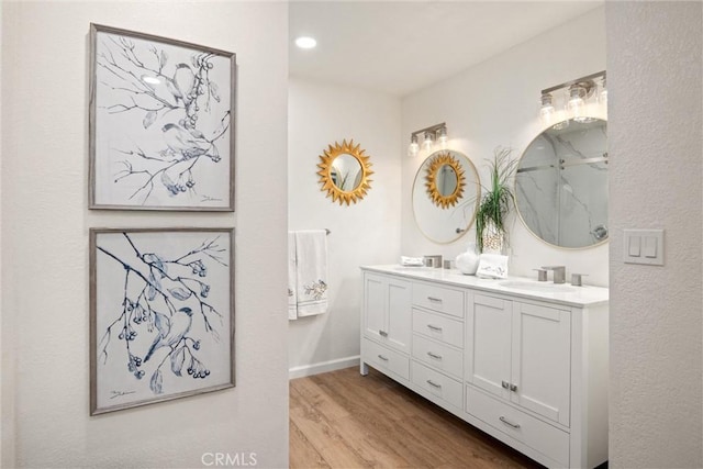 bathroom with vanity and hardwood / wood-style floors