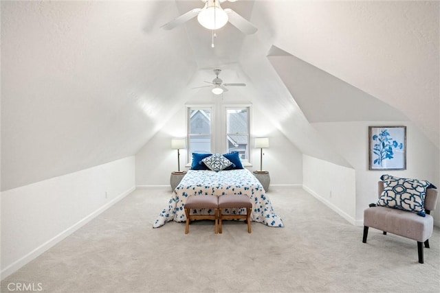 bedroom with ceiling fan, lofted ceiling, and light carpet