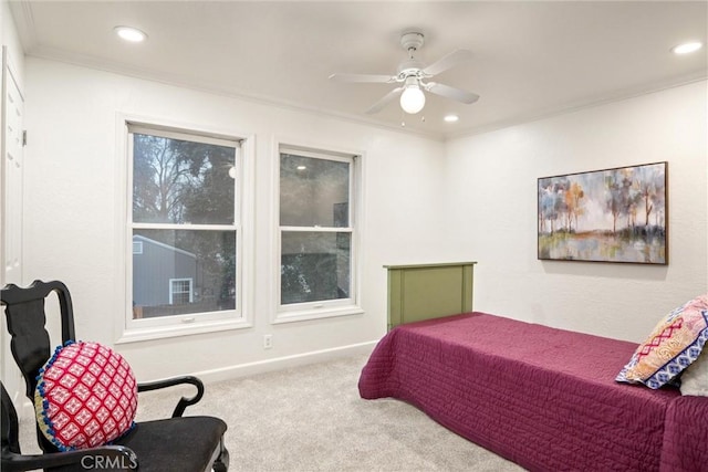 bedroom with crown molding, carpet, and ceiling fan