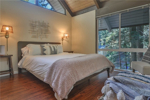 bedroom with vaulted ceiling with beams, wood ceiling, and dark wood-type flooring