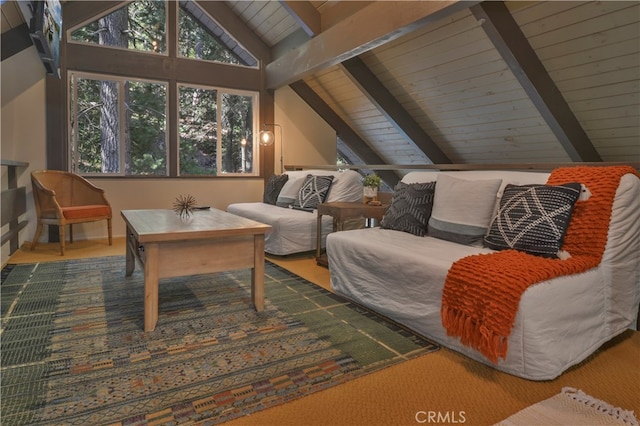 living area with vaulted ceiling with beams