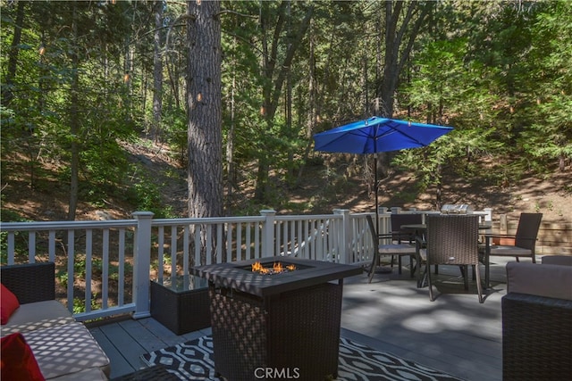 deck with an outdoor fire pit