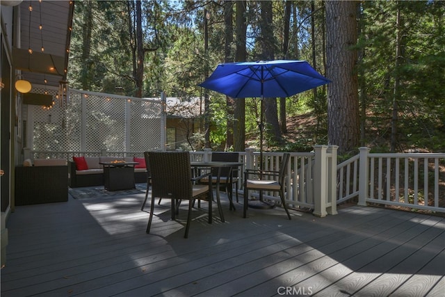 wooden deck featuring an outdoor hangout area