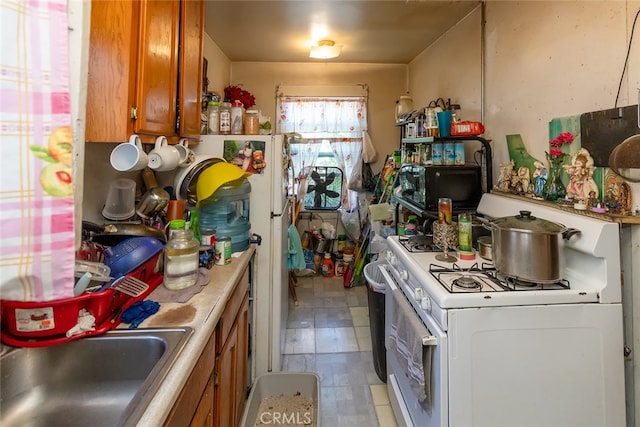 kitchen with white gas range oven