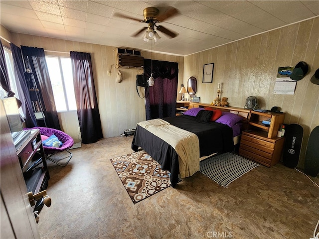 bedroom with ceiling fan and a wall unit AC