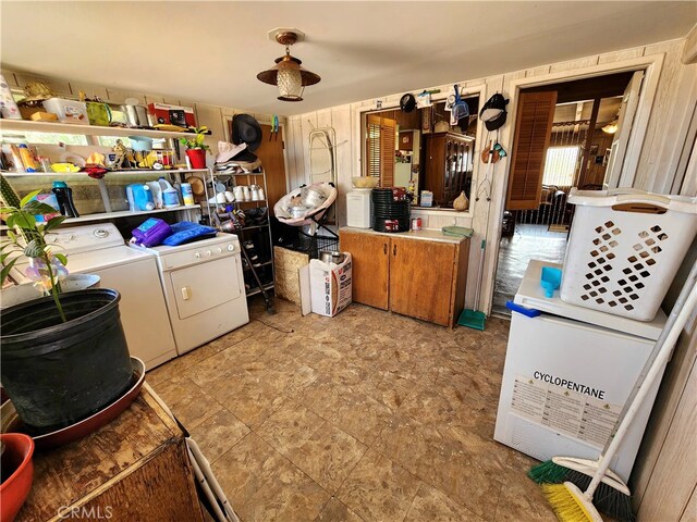 clothes washing area with washing machine and clothes dryer