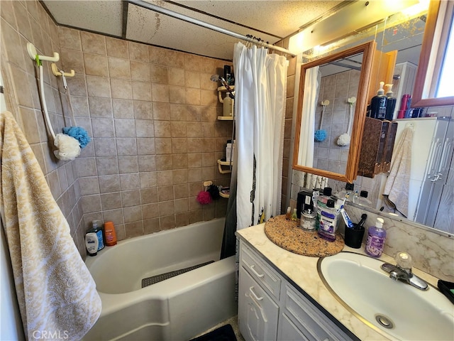 bathroom featuring shower / bathtub combination with curtain, decorative backsplash, and vanity